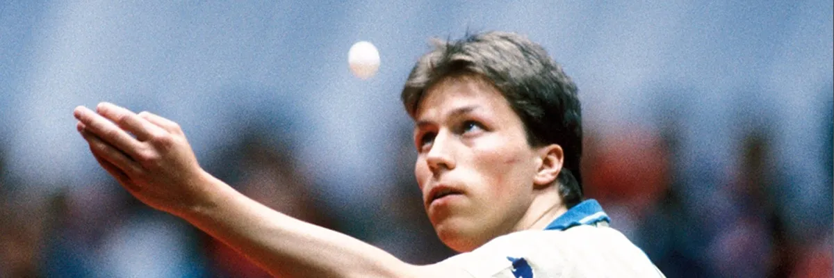Jan-Ove Waldner playing a shakehand backhand at a world championship
