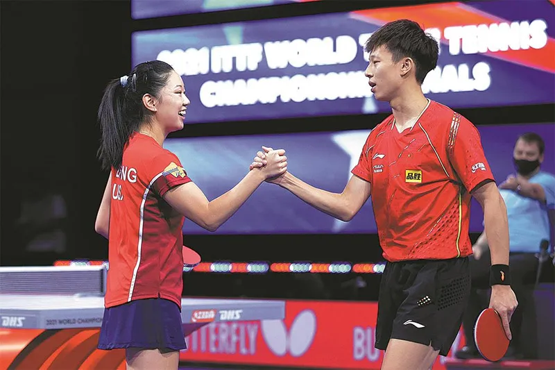 Lily Zhang and Lin Gaoyuan playing in the Mixed Doubles