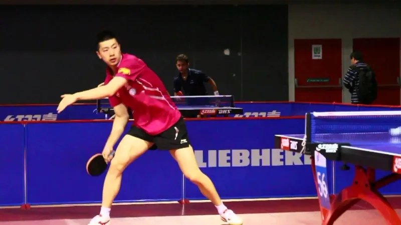 A picture of Ma Long, preparing to unleash his mighty forehand loop.