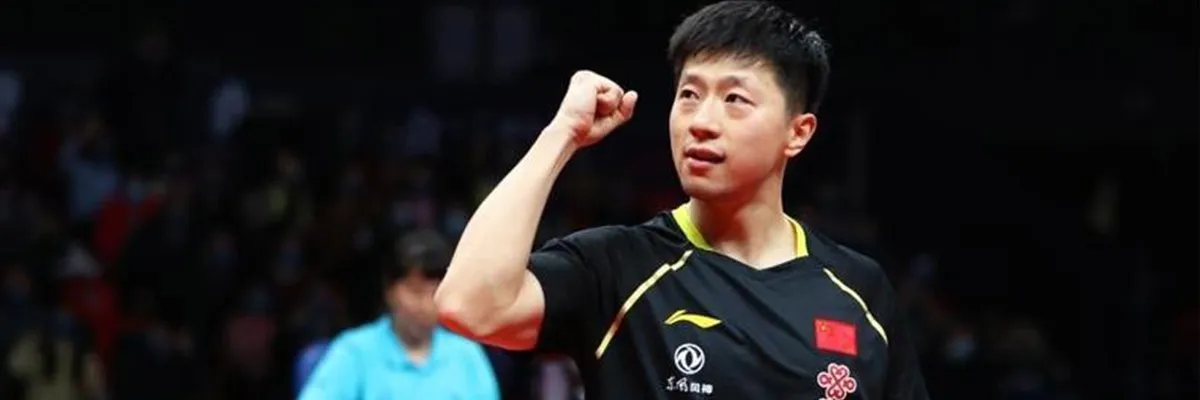 Ma Long unleashing his signature forehand loop during a Grand Slam final