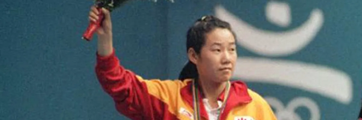 Qiao Hong playing a backhand drive during an international match