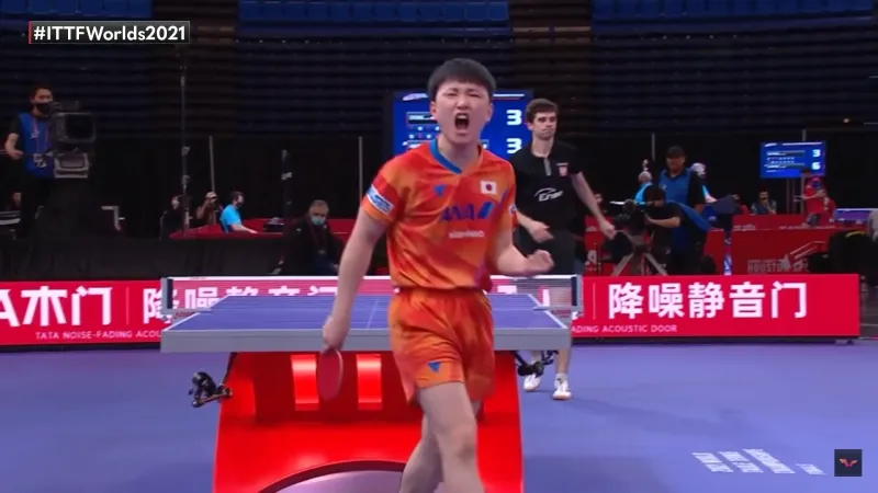 A picture of a Table Tennis player shouting a point.