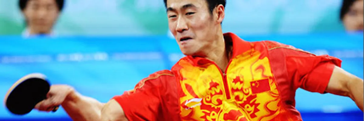 Wang Liqin driving a forehand loop at a major international event