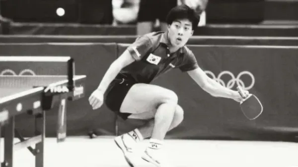 A picture of Yoo Nam-Kyu winning the first Olympic men’s singles event.